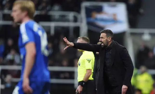 Leicester City's manager Ruud van Nistelrooy gestures, during the English Premier League soccer match between Newcastle United and Leicester City, at St. James' Park, in Newcastle upon Tyne, England, Saturday, Dec. 14, 2024. (Owen Humphreys/PA via AP)