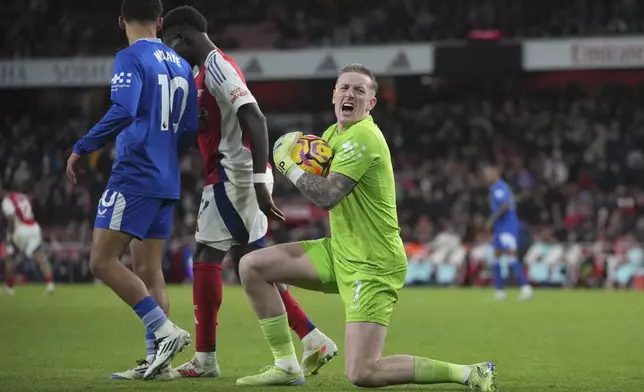 Everton's goalkeeper Jordan Pickford in action during the English Premier League soccer match between Arsenal and Everton at Emirates Stadium in London, Saturday, Dec. 14, 2024. (AP Photo/Kin Cheung)