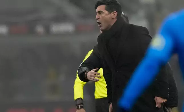 AC Milan's head coach Paulo Fonseca gives instructions during the Italian Serie A soccer match between AC Milan and Empoli, at the Milan San Siro stadium, Italy, Saturday, Nov. 30, 2024. (AP Photo/Luca Bruno)