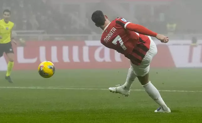 AC Milan's Alvaro Morata scores his side's opening goal during the Italian Serie A soccer match between AC Milan and Empoli, at the Milan San Siro stadium, Italy, Saturday, Nov. 30, 2024. (AP Photo/Luca Bruno)