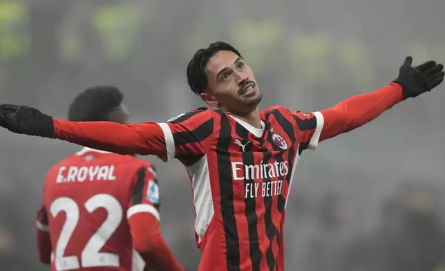 AC Milan's Tijjani Reijnders celebrates scoring his side's third goal during the Italian Serie A soccer match between AC Milan and Empoli, at the Milan San Siro stadium, Italy, Saturday, Nov. 30, 2024. (AP Photo/Luca Bruno)