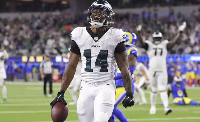 Philadelphia Eagles running back Kenneth Gainwell (14) reacts after scoring against the Los Angeles Rams during the second half of an NFL football game in Inglewood, Calif., Sunday, Nov. 24, 2024. (AP Photo/Ryan Sun)