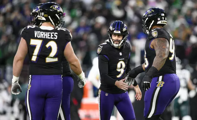 Baltimore Ravens kicker Justin Tucker (9) reacts with teammates after kicking a field goal against the Philadelphia Eagles during the first half of an NFL football game, Sunday, Dec. 1, 2024, in Baltimore. (AP Photo/Nick Wass)