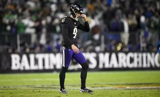 Baltimore Ravens kicker Justin Tucker reacts after missing his second field goal of the second half of an NFL football game against the Philadelphia Eagles, Sunday, Dec. 1, 2024, in Baltimore. (AP Photo/Nick Wass)