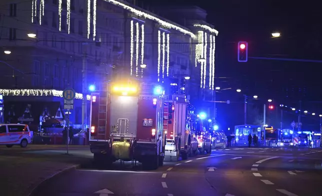 Emergency services attend an incident at the Christmas market in Magdeburg, Germany, Friday Dec. 20, 2024. (Heiko Rebsch/dpa via AP)