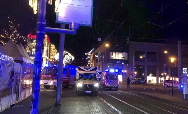 Emergency services attend an incident at the Christmas market in Magdeburg, Germany, Friday Dec. 20, 2024. (Dörthe Hein/dpa via AP)