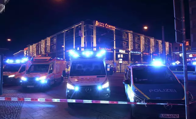 Emergency services attend an incident at the Christmas market in Magdeburg, Germany, Friday Dec. 20, 2024. (Heiko Rebsch/dpa via AP)