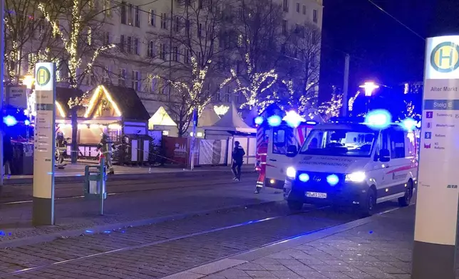 Emergency services attend an incident at the Christmas market in Magdeburg, Germany, Friday Dec. 20, 2024. (Dörthe Hein/dpa via AP)