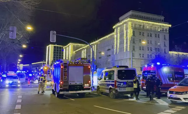 Emergency services attend an incident at the Christmas market in Magdeburg, Germany, Friday Dec. 20, 2024. (Heiko Rebsch/dpa via AP)