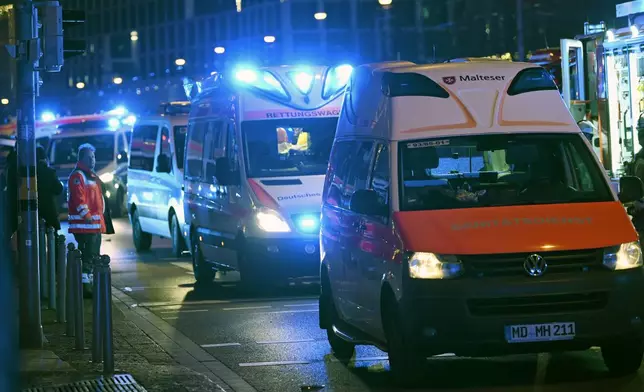 Emergency services attend an incident at the Christmas market in Magdeburg, Germany, Friday Dec. 20, 2024. (Heiko Rebsch/dpa via AP)