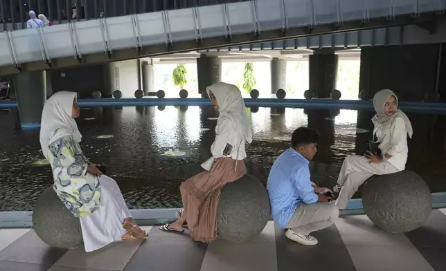 Students visit the Tsunami Museum in Banda Aceh, Indonesia, Saturday, Dec 14, 2024. (AP Photo/Achmad Ibrahim)