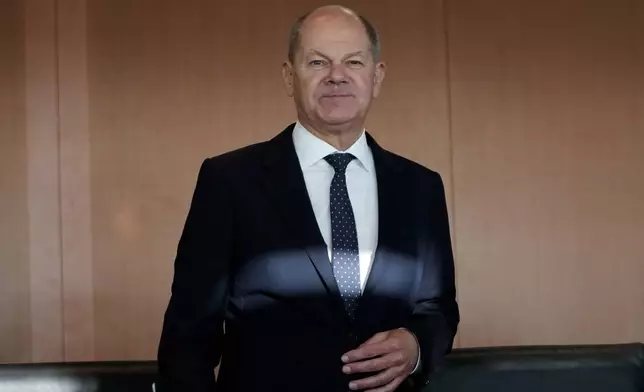 FILE - German Chancellor Olaf Scholz arrives for a German government cabinet meeting at the chancellery in Berlin, Germany, Nov. 27, 2024. (AP Photo/Markus Schreiber, File)