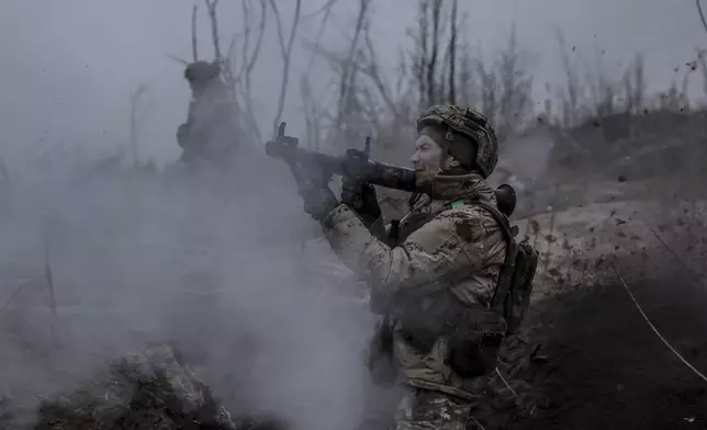 In this photo provided by Ukraine's 24th Mechanised Brigade press service, a serviceman of the 24th Mechanised Brigade improves his tactical skills at the training field in Donetsk region, Ukraine, Friday, Nov. 29, 2024. (Oleg Petrasiuk/Ukrainian 24th Mechanised Brigade via AP)