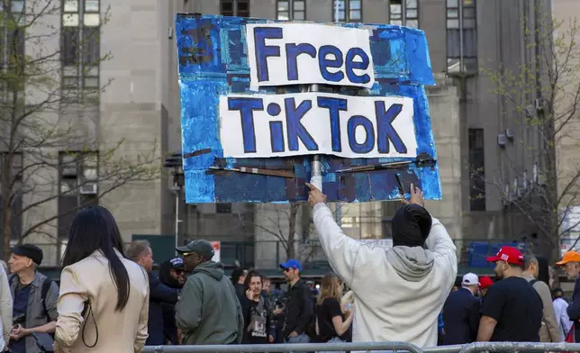 FILE - A man carries a Free TikTok sign in front of the courthouse where the hush-money trial of Donald Trump was underway on April 15, 2024, in New York. (AP Photo/Ted Shaffrey, File)