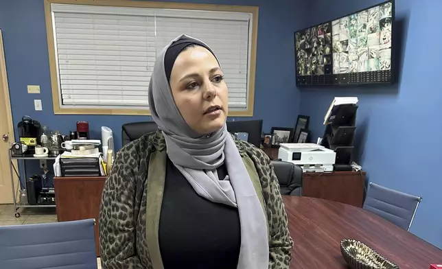 Rama Alhoussaini stands in her office in Dearborn Heights, Mich., Tuesday, Dec. 10, 2024. (AP Photo/Corey Williams)