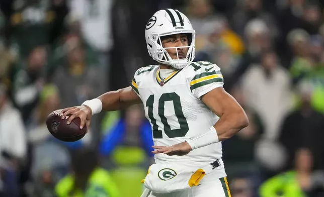 Green Bay Packers' Jordan Love throws during the first half of an NFL football game against the Seattle Seahawks Sunday, Dec. 15, 2024, in Seattle. (AP Photo/Lindsey Wasson)