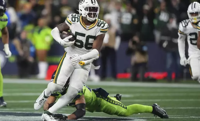 Green Bay Packers' Edgerrin Cooper intercepts a pass during the second half of an NFL football game against the Seattle Seahawks Sunday, Dec. 15, 2024, in Seattle. (AP Photo/Lindsey Wasson)