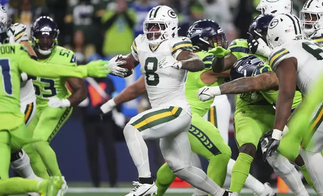 Green Bay Packers' Josh Jacobs runs during the first half of an NFL football game against the Seattle Seahawks Sunday, Dec. 15, 2024, in Seattle. (AP Photo/Lindsey Wasson)