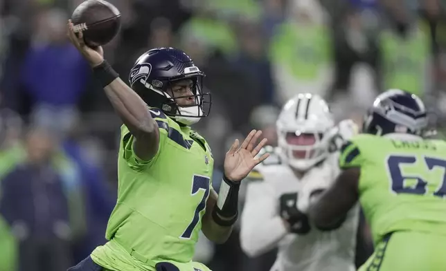 Seattle Seahawks' Geno Smith throws during the first half of an NFL football game against the Green Bay Packers Sunday, Dec. 15, 2024, in Seattle. (AP Photo/Stephen Brashear)