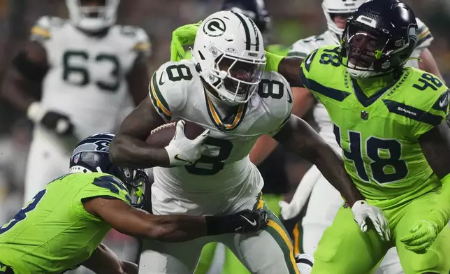 Green Bay Packers' Josh Jacobs runs during the first half of an NFL football game against the Seattle Seahawks Sunday, Dec. 15, 2024, in Seattle. (AP Photo/Lindsey Wasson)