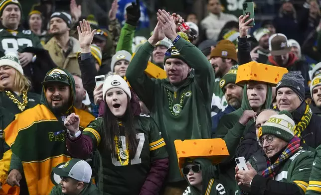 Green Bay Packers fans cheer during the second half of an NFL football game against the Seattle Seahawks Sunday, Dec. 15, 2024, in Seattle. (AP Photo/Lindsey Wasson)