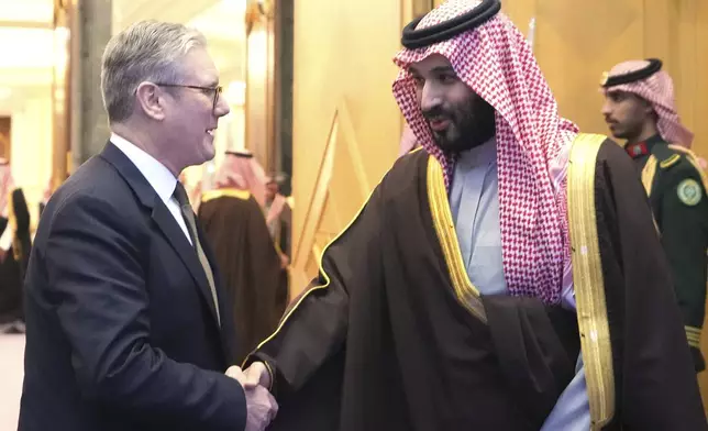 Britain's Prime Minister Keir Starmer meets Saudi Arabian Crown Prince Mohammed bin Salman Al Saud at the Royal Court in Riyadh, Saudi Arabia, Monday, Dec. 9, 2024 during his three day visit of United Arab Emirates, Saudi Arabia and Cyprus.(AP Photo/Kirsty Wigglesworth, Pool)