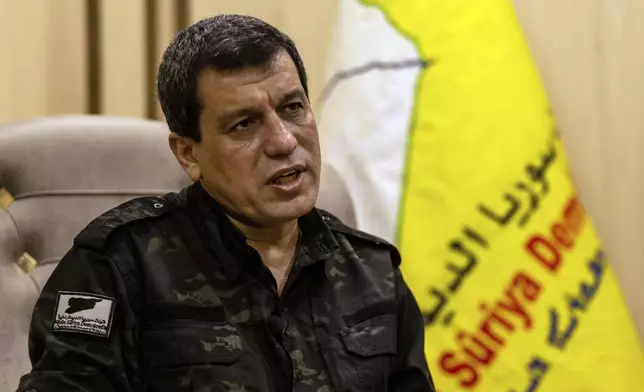 FILE - Mazloum Abdi, the commander of the U.S.-backed Syrian Democratic Forces, speaks during a news conference in Hassakeh, Syria, Nov. 26, 2022. (AP Photo/Baderkhan Ahmad, File)