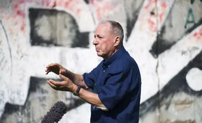 FILE -In this Sept. 4, 2019 photo, Frieder Reimold the former Berlin bureau chief of The Associated Press' German service gestures during an interview with the Associated Press in Berlin, Germany. (AP Photo/Markus Schreiber, File)