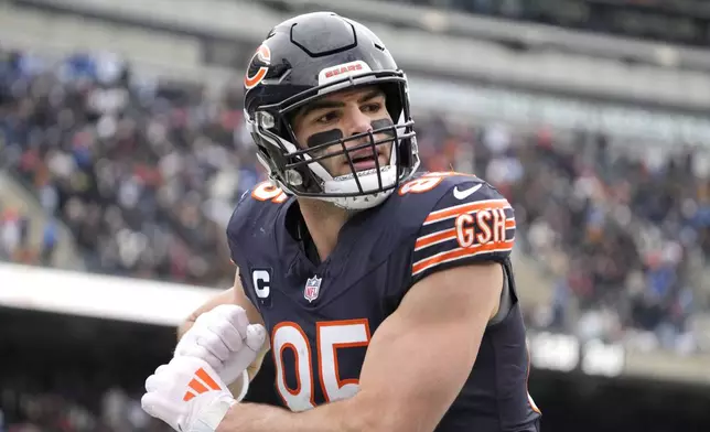 Chicago Bears tight end Cole Kmet celebrates his touchdown reception from quarterback Caleb Williams during the first half of an NFL football game against the Detroit Lions on Sunday, Dec. 22, 2024, in Chicago. (AP Photo/Nam Y. Huh)