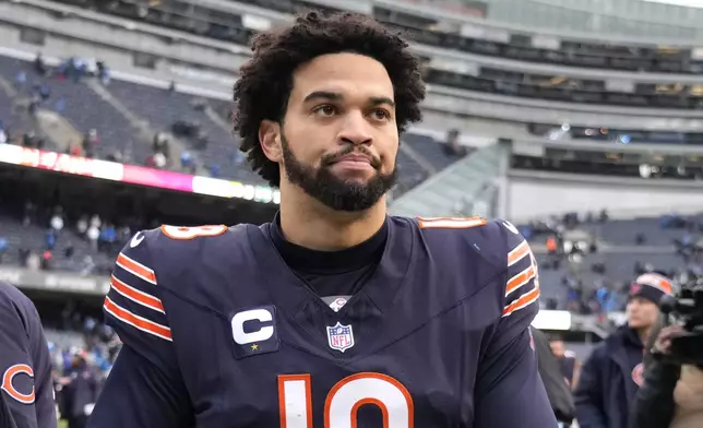 Chicago Bears quarterback Caleb Williams walks off the field after his team's 34-17 loss to the Detroit Lions in an NFL football game Sunday, Dec. 22, 2024, in Chicago. (AP Photo/Nam Y. Huh)