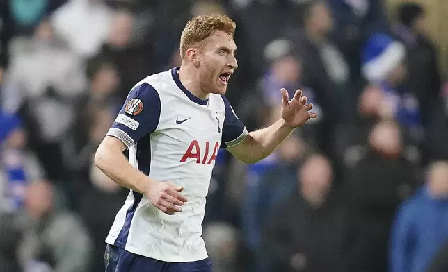 Tottenham Hotspur's Dejan Kulusevski celebrates scoring their side's first goal of the game against Rangers during a UEFA Europa League soccer match at the Ibrox Stadium, Thursday, Dec. 12, 2024, in Glasgow, Scotland. (Jane Barlow/PA via AP)