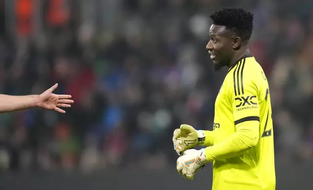 Manchester United's goalkeeper Andre Onana reacts during the Europa League soccer match between Viktoria Plzen and Manchester United at the Doosan Arena in Plzen, Czech Republic, Thursday, Dec. 12, 2024. (AP Photo/Petr David Josek)