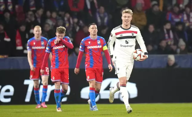 Manchester United's Rasmus Hojlund, right, celebrates after scoring his side's opening goal during the Europa League soccer match between Viktoria Plzen and Manchester United at the Doosan Arena in Plzen, Czech Republic, Thursday, Dec. 12, 2024. (AP Photo/Petr David Josek)