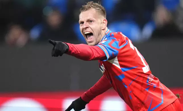 Plzen's Matej Vydra celebrates after scoring his side's opening goal during the Europa League soccer match between Viktoria Plzen and Manchester United at the Doosan Arena in Plzen, Czech Republic, Thursday, Dec. 12, 2024. (AP Photo/Petr David Josek)