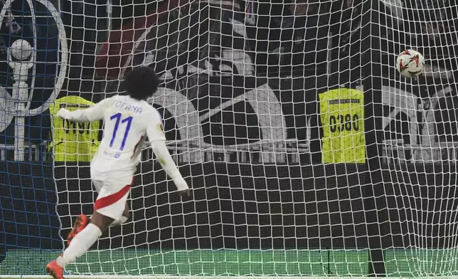 Lyon's Malick Fofana scores his side' second goal during the Europa League soccer match between Lyon and Eintracht Frankfurt at Decines stadium outside Lyon, France, Thursday, Dec. 12, 2024. (AP Photo/Michel Euler)