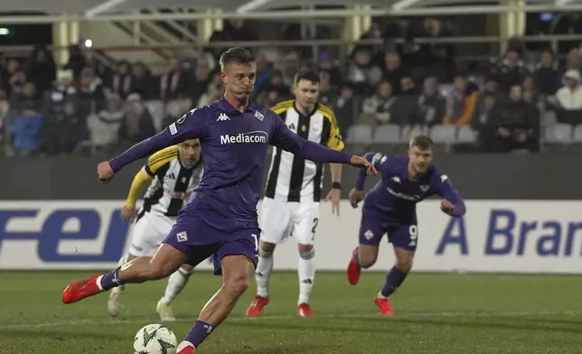 Fiorentina's Albert Gudmundsson scores his side's seventh goal during the Europa Conference League opening phase soccer match between Fiorentina and LASK at the Artemio Franchi Stadium in Florence, Italy, Thursday Dec. 12, 2024. (Massimo Paolone/LaPresse via AP)