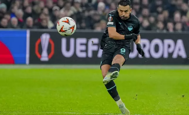 Lazio's Pedro kicks the ball during the Europa League soccer match between Ajax and Lazio Roma at the Johan Cruyff Arena in Amsterdam, Netherlands, Thursday, Dec. 12, 2024. (AP Photo/Peter Dejong)