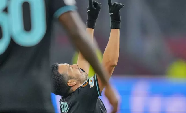 Lazio's Pedro celebrates after scoring during the Europa League soccer match between Ajax and Lazio Roma at the Johan Cruyff Arena in Amsterdam, Netherlands, Thursday, Dec. 12, 2024. (AP Photo/Peter Dejong)