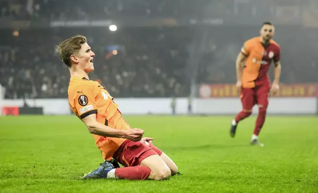 Galatasaray's Elias Jelert celebrates after scoring his side's opening goal during the Europa League opening phase soccer match between Malmo FF and Galatasaray SK at the Malmo New Stadium in Malmo, Sweden, Thursday, Dec. 12, 2024. (Andreas Hillergren/TT News Agency via AP)