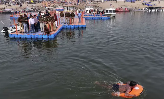 Police officials test a remote-controlled lifebuoy on the Ganges river, in preparation for the upcoming Maha Kumbh Mela, one of the world's largest religious festivals in Prayagraj, India, Tuesday, Dec. 3, 2024. (AP Photo/Rajesh Kumar Singh)