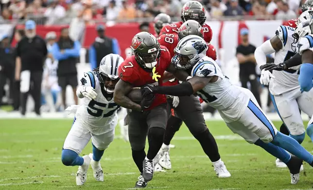 Tampa Bay Buccaneers running back Bucky Irving plays against the Carolina Panthers during the second half of an NFL football game Sunday, Dec. 29, 2024, in Tampa, Fla. (AP Photo/Jason Behnken)