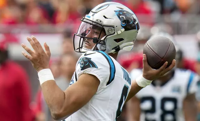 Carolina Panthers quarterback Bryce Young passes against the Tampa Bay Buccaneers during the first half of an NFL football game Sunday, Dec. 29, 2024, in Tampa, Fla. (AP Photo/Chris O'Meara)