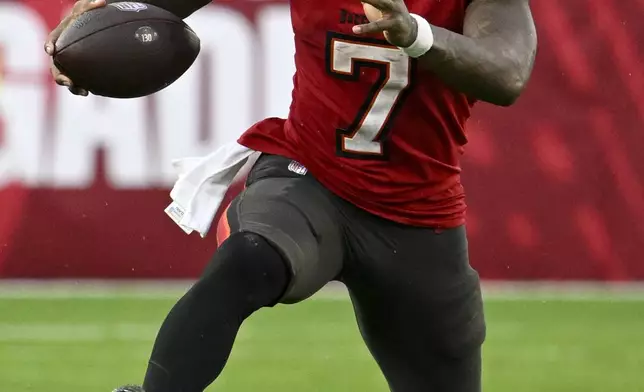 Tampa Bay Buccaneers running back Bucky Irving runs against the Carolina Panthers during the second half of an NFL football game Sunday, Dec. 29, 2024, in Tampa, Fla. (AP Photo/Jason Behnken)