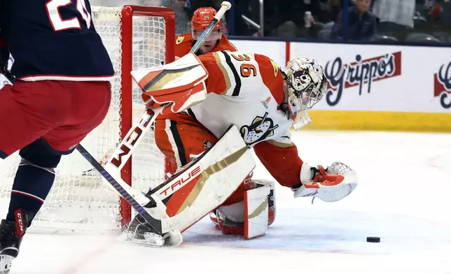 Anaheim Ducks goaltender John Gibson (36) saves the puck against the Columbus Blue Jackets during the second period of an NHL hockey game Saturday, Dec. 14, 2024, in Columbus, Ohio. (AP Photo/Joe Maiorana)