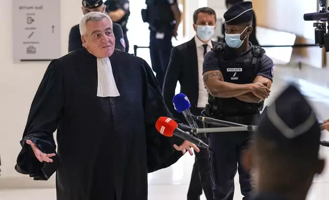 FILE - Thierry Herzog, lawyer of former French President Nicolas Sarkozy, speaks to the media after the verdict was announcement at Paris' courthouse, Thursday, Sept. 30, 2021. (AP Photo/Michel Euler, File)