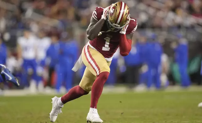 San Francisco 49ers wide receiver Deebo Samuel Sr. reacts after dropping a pass against the Los Angeles Rams during the second half of an NFL football game in Santa Clara, Calif., Thursday, Dec. 12, 2024. (AP Photo/Godofredo A. Vásquez)