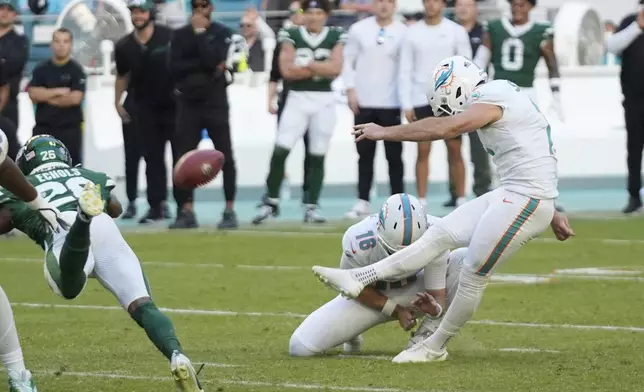 Miami Dolphins place kicker Jason Sanders (7) kicks a field goal to tie the game during the second half of an NFL football game against the New York Jets, Sunday, Dec. 8, 2024, in Miami Gardens, Fla. (AP Photo/Wilfredo Lee)