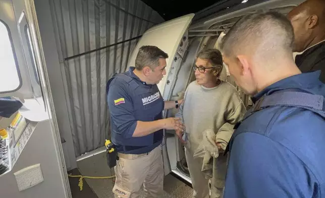 This photo released by the Colombian Immigration press office shows Colombian Fabio Ochoa, a former member of Cartel of Medellin, deplaning at the El Dorado International Airport in Bogota, Colombia, after being deported from the U.S. where he served time for drug trafficking, Monday, Dec. 23, 2024. (Colombian Immigration via AP)