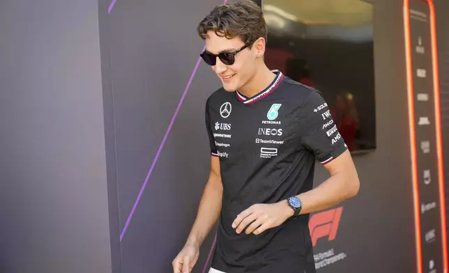Mercedes driver George Russell of Britain is in paddock ahead of the Formula One Abu Dhabi Grand Prix, at the Yas Marina Circuit in Abu Dhabi, UAE, Thursday, Dec. 5, 2024. (AP Photo/Darko Bandic)
