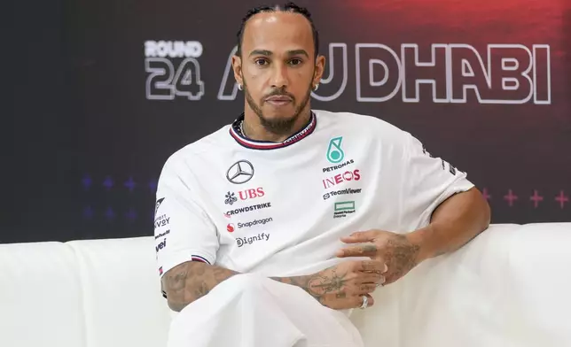Mercedes driver Lewis Hamilton of Britain attends a news conference ahead of the Formula One Abu Dhabi Grand Prix, at the Yas Marina Circuit in Abu Dhabi, UAE, Thursday, Dec. 5, 2024. (AP Photo/Darko Bandic)